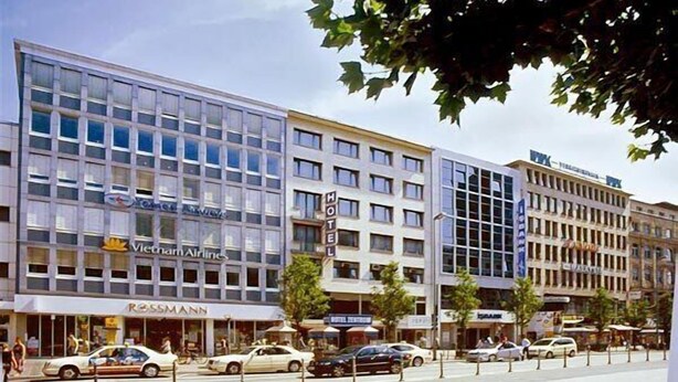 A modern building with multiple floors, featuring a prominent 'Motel' sign. - Hotel Zentrum (Frankfurt)