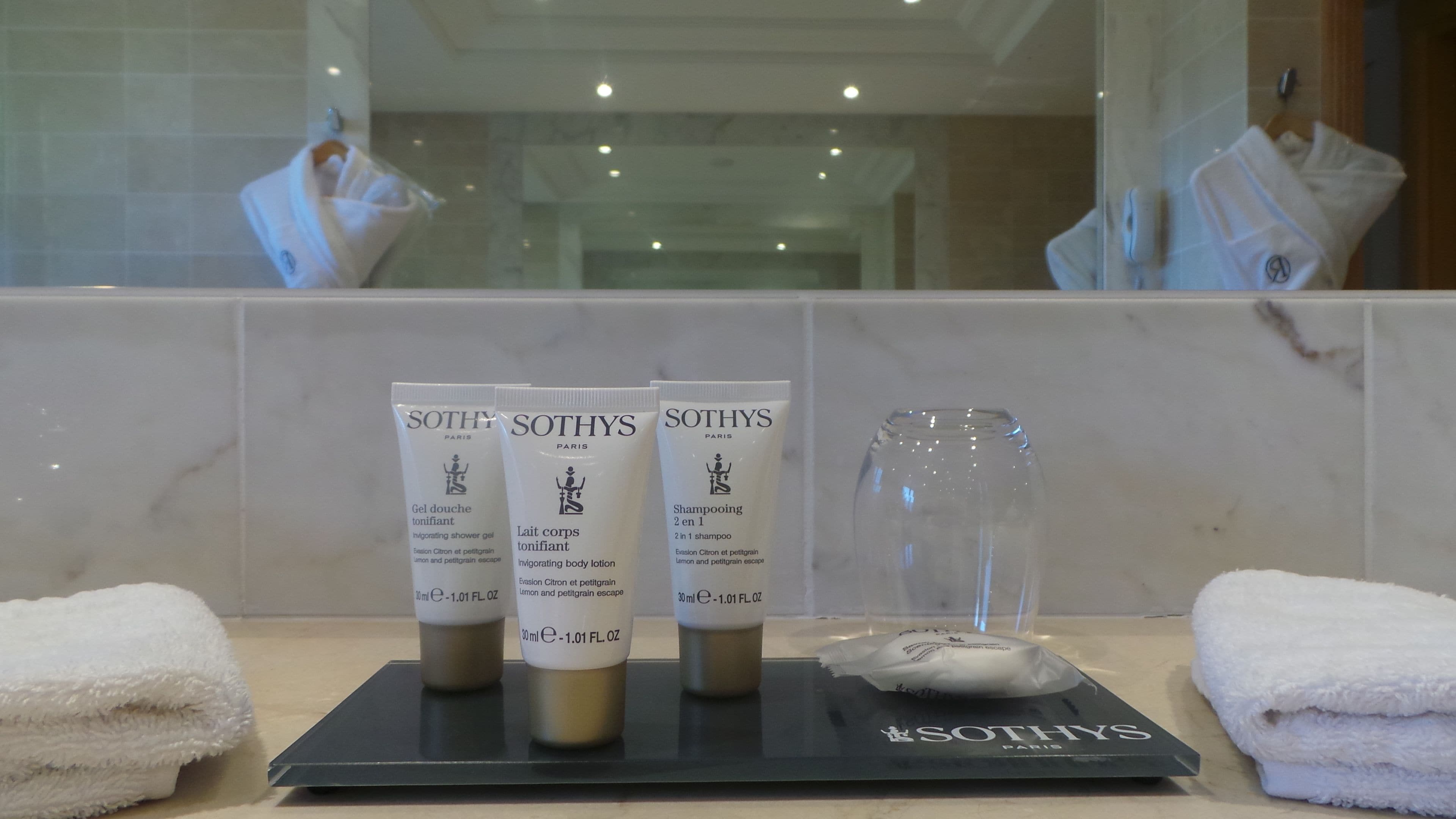 separate bathtub and shower, rainfall showerhead, designer toiletries