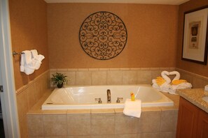 Separate bathtub and shower, deep-soaking bathtub, designer toiletries