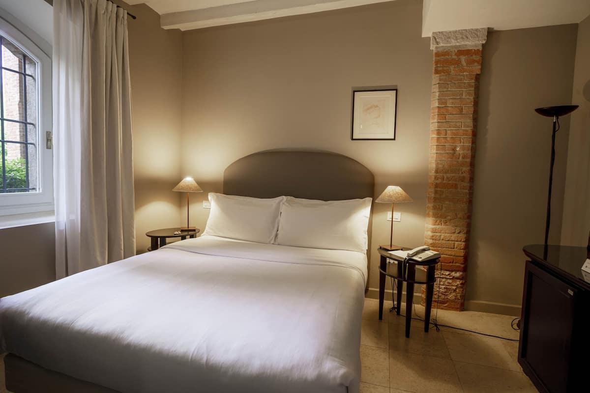 Hypo-allergenic bedding available, down comforters, minibar