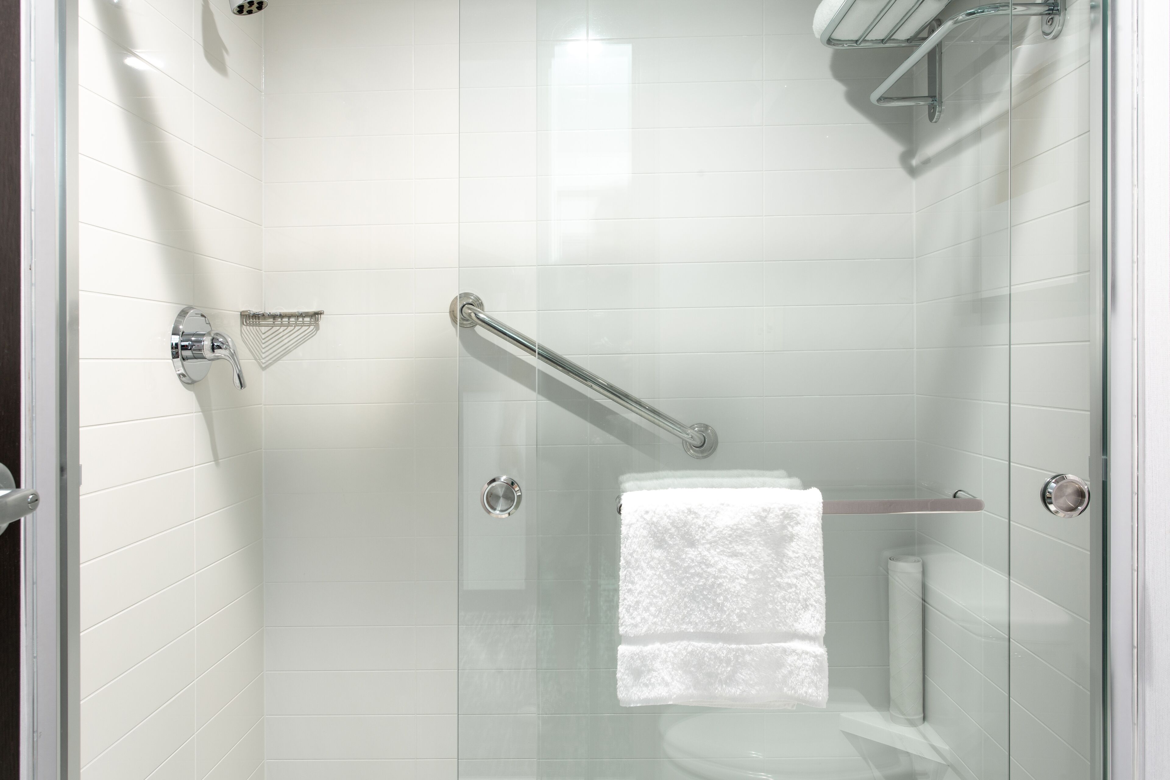 shower, designer toiletries, hair dryer, towels