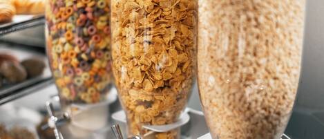 Three cereal dispensers with different flavors.