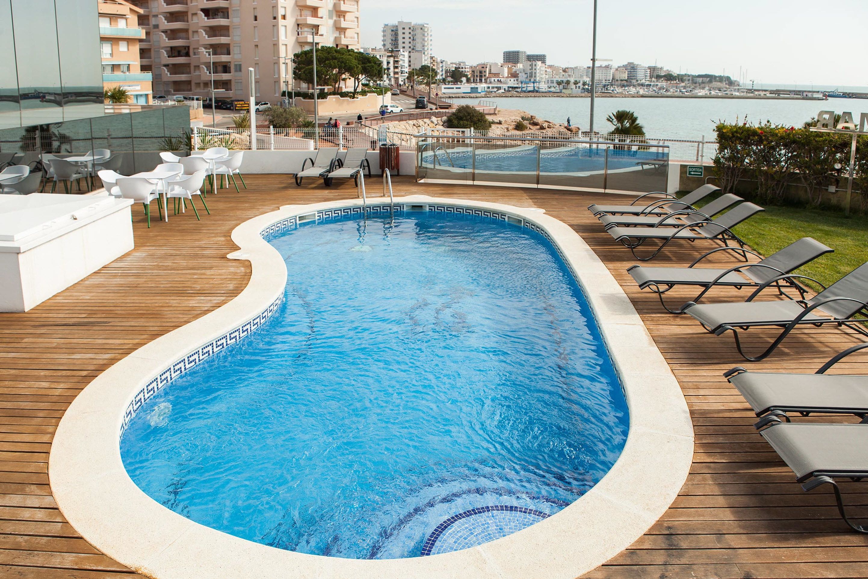 outdoor pool, open 9:00 am to 9:00 pm, pool umbrellas, pool loungers