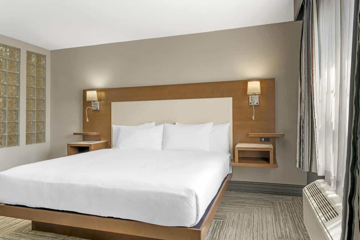 Suite, 1 King Bed, Non Smoking, Jetted Tub (with Sofabed) | Premium bedding, pillow-top beds, in-room safe, laptop workspace