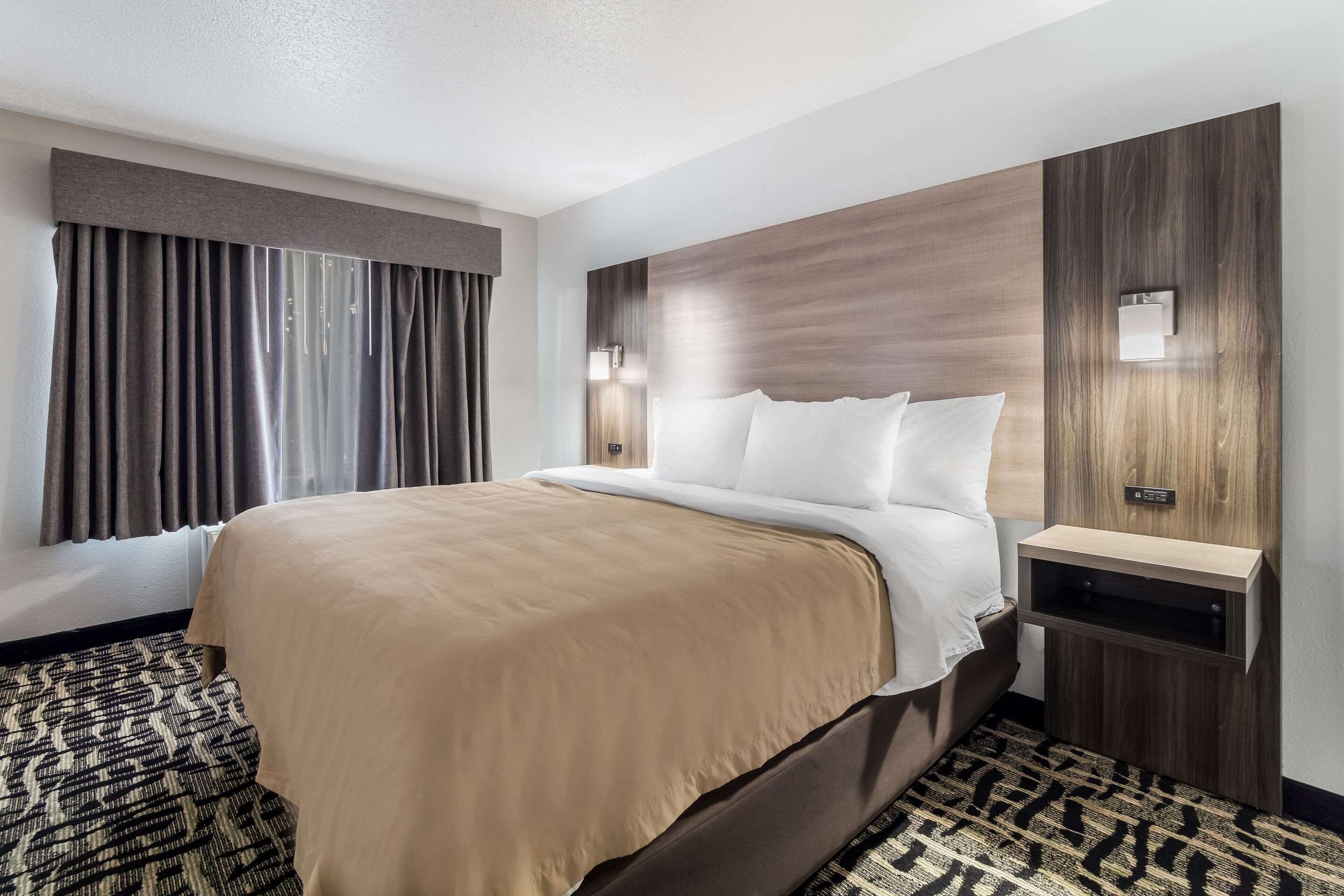 suite 1 king 1 queen non smoking 1 person sofabed | premium bedding, desk, laptop workspace, blackout curtains