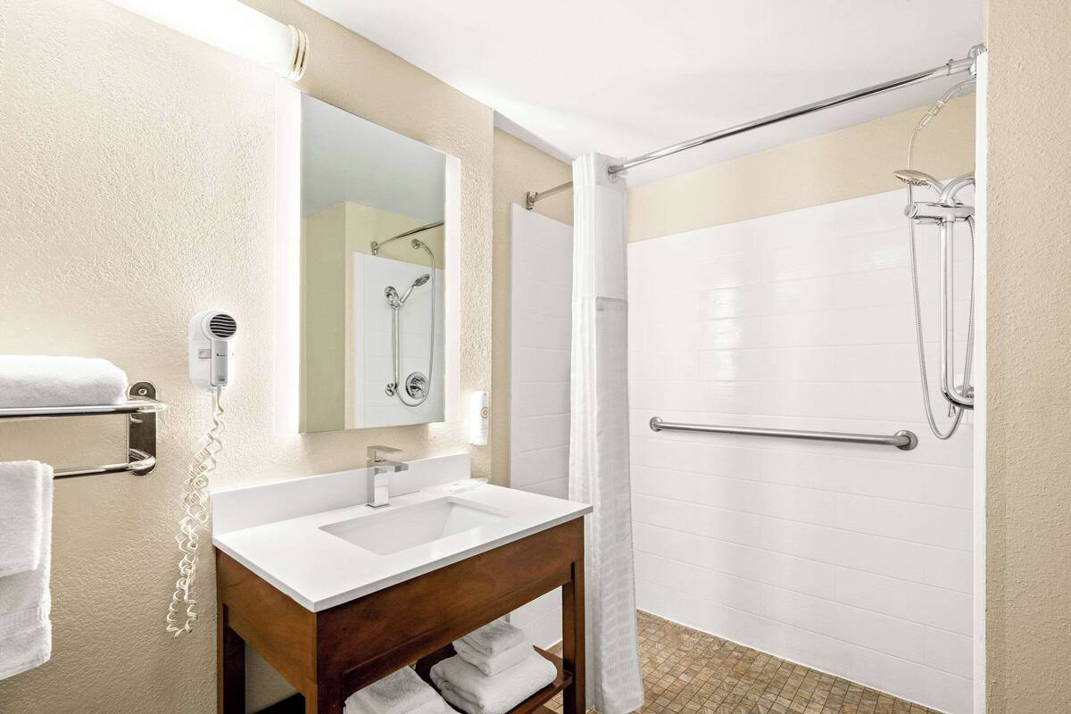 desk, blackout curtains, iron/ironing board, free cots/infant beds