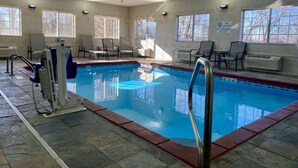 An indoor swimming pool with a lifeguard chair, lounge chairs, and a no diving sign. - Best Western Emporia Inn (Emporia)