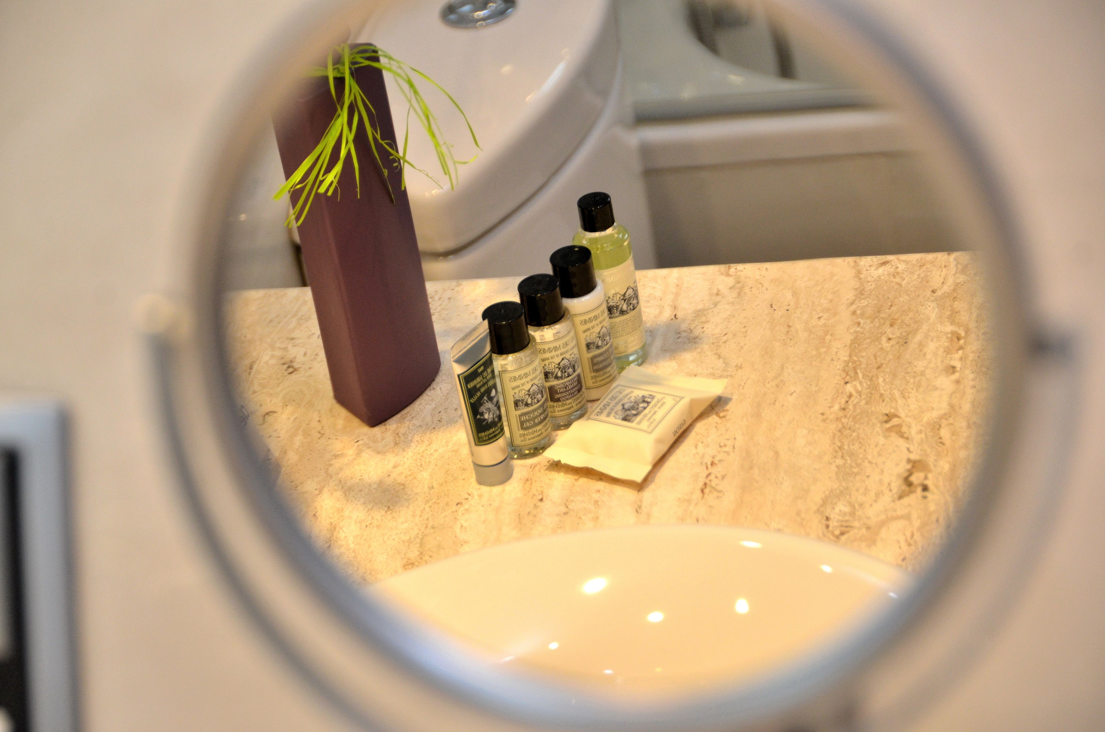 hair dryer, slippers, bidet, towels