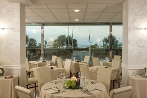 Lunch, dinner served; international cuisine, beach views 