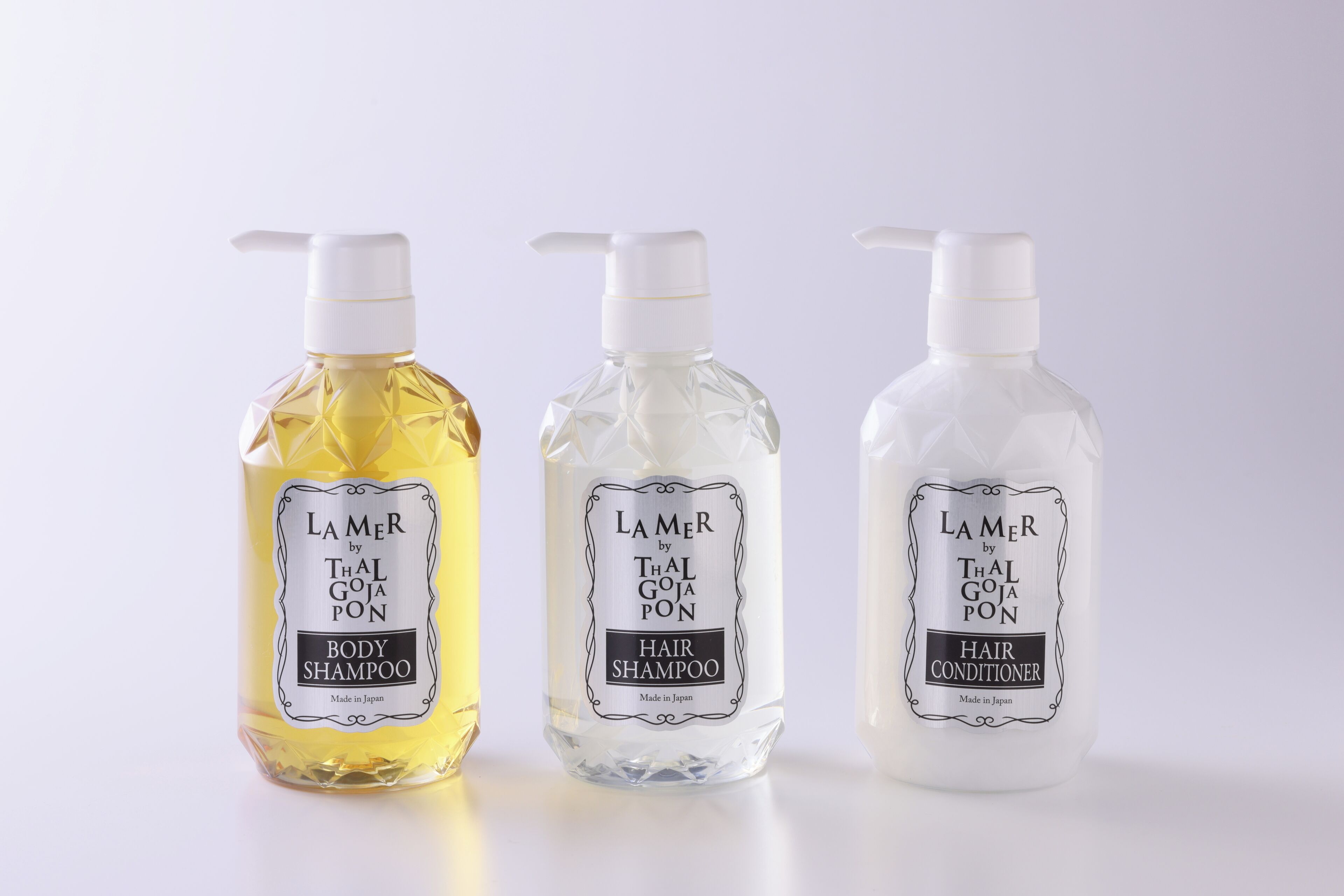 Three bottles of Lamer by Thal Goja Pon hair products.