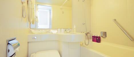 A bathroom with a toilet, sink, and shower.