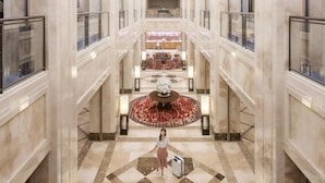 A spacious lobby with a central seating area, a reception desk, and a decorative floral arrangement. - Hotel Nikko Nara (Nara)