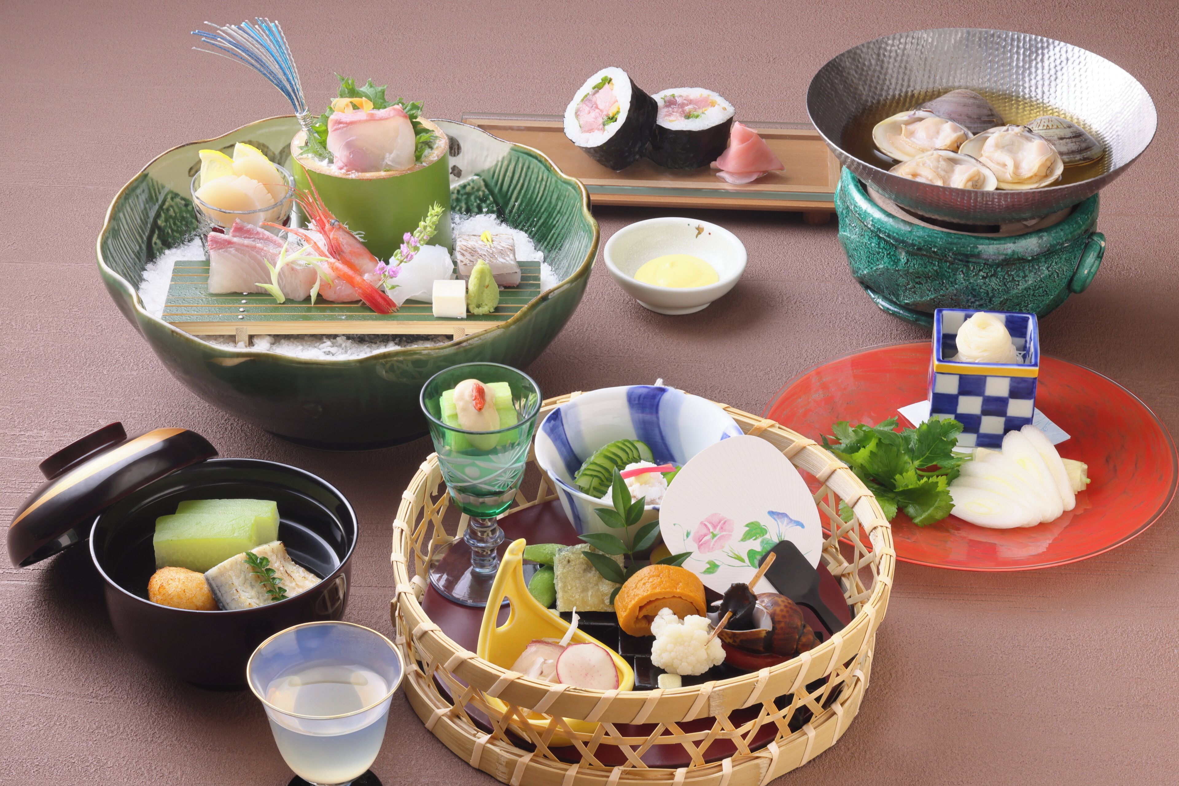 A traditional Japanese meal setup with various dishes and utensils.