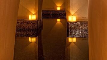 Stunning interior corridor with arches and a smooth, tiled floor.