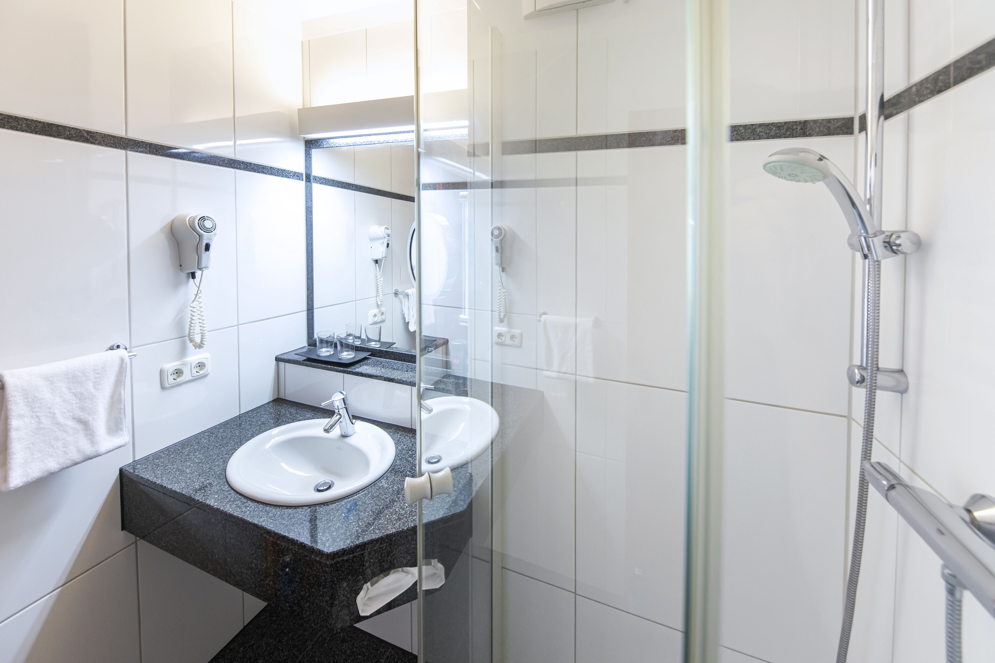superior double room | bathroom | hair dryer, towels