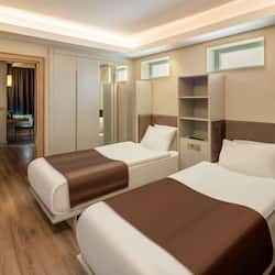 Deluxe Family Room | 2 bedrooms, premium bedding, free minibar, in-room safe