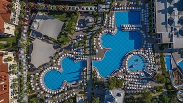 Relax by the heart-shaped pools and sunbathe on comfortable loungers amidst lush greenery.