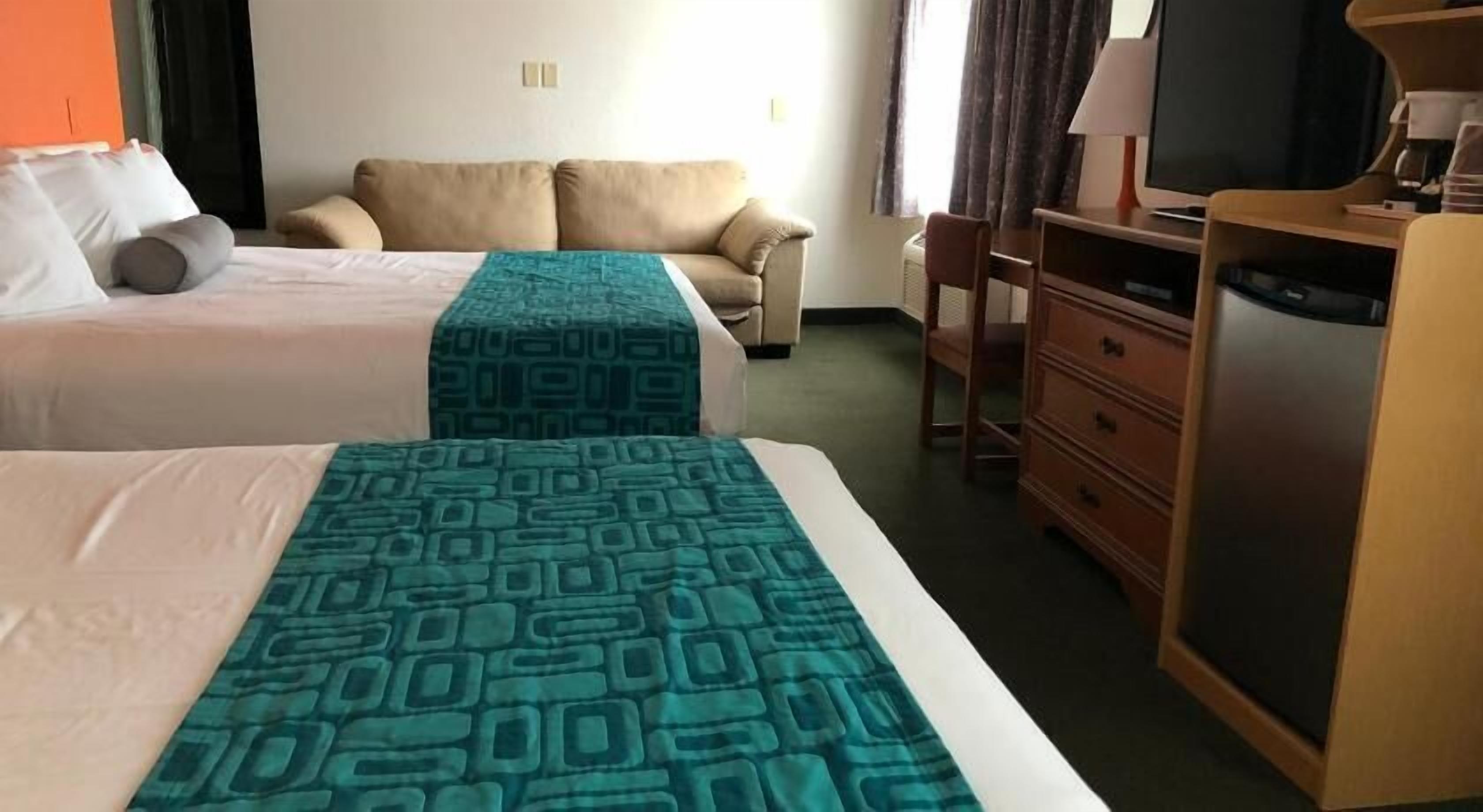 Premium bedding, desk, iron/ironing board, free cribs/infant beds