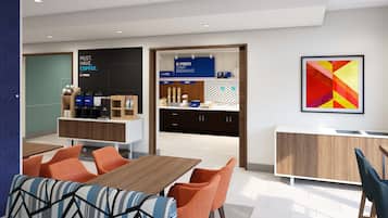 A modern dining area with a wooden table and orange chairs, a coffee station with a sign reading "EXPRESS START BREAKFAST", and a colorful abstract painting on the wall.