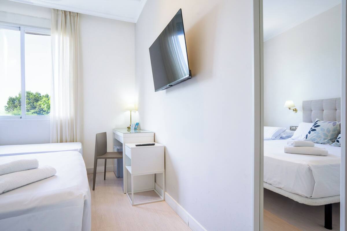 Standard Triple Room | Minibar, desk, laptop workspace, blackout drapes