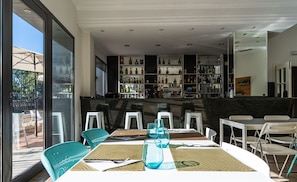 Breakfast, lunch, dinner served; local cuisine, al fresco dining