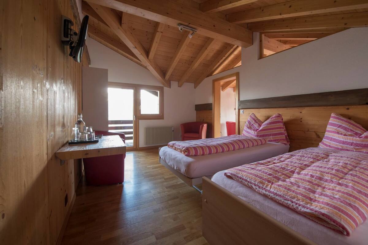 family room, balcony, mountain view | premium bedding, in-room safe, desk, free cots/infant beds