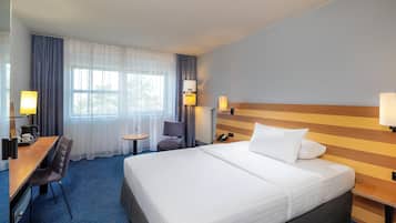 Hypoallergeen beddengoed, een minibar, een kluis op de kamer, een bureau