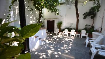 Seasonal outdoor pool, open 11:00 AM to 8:00 PM, pool loungers