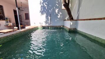 Seasonal outdoor pool, open 11:00 AM to 8:00 PM, pool loungers