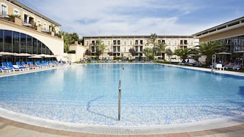 Indoor pool, outdoor pool, pool umbrellas, pool loungers
