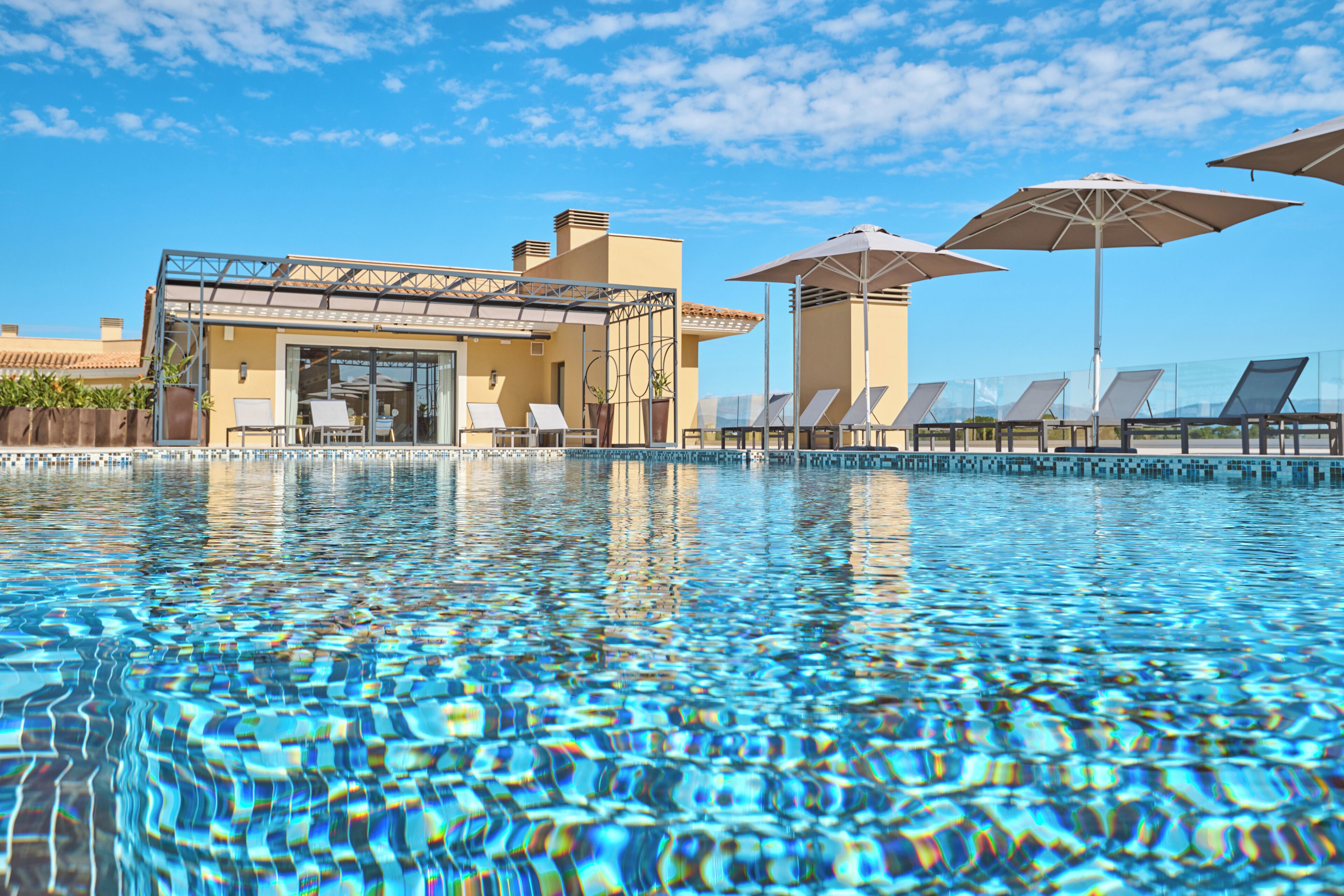 Indoor pool, outdoor pool, pool umbrellas, pool loungers