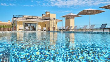 Indoor pool, outdoor pool, pool umbrellas, pool loungers