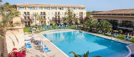 Indoor pool, outdoor pool, pool umbrellas, pool loungers