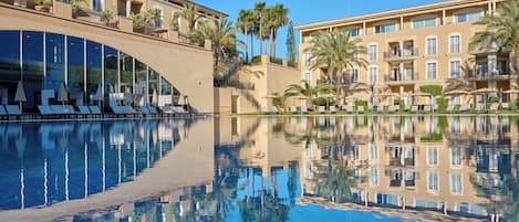 Indoor pool, outdoor pool, pool umbrellas, sun loungers