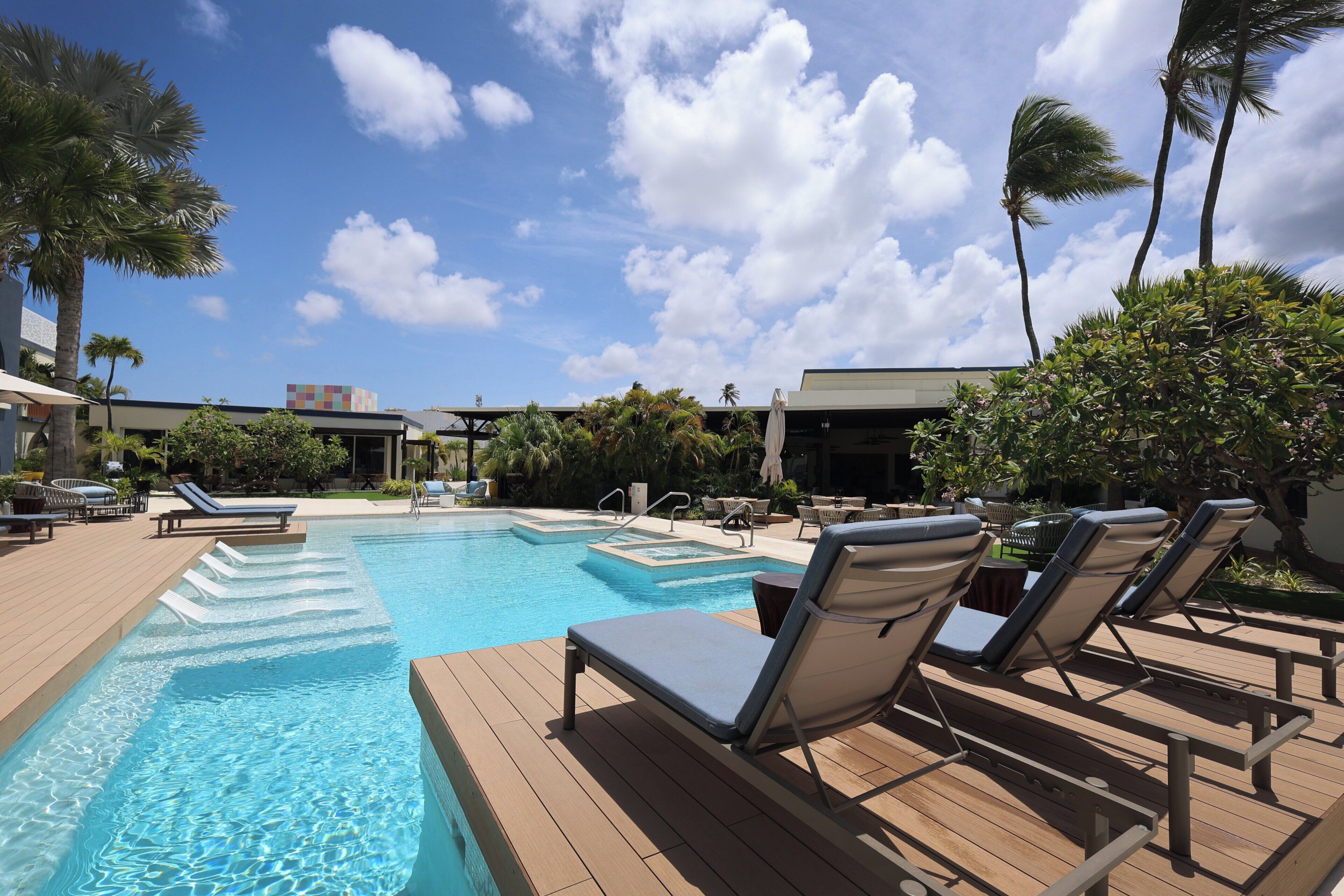 Outdoor pool, open 8:00 AM to 8:00 PM, pool loungers