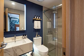 Standard Room, 2 Queen Beds, City View | Bathroom | Shower, hair dryer, towels