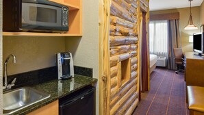 A compact hotel room with a kitchenette, including a microwave, coffee maker, and sink. - Holiday Inn Express Hotel & Suites Brainerd-Baxter by IHG (Brainerd)