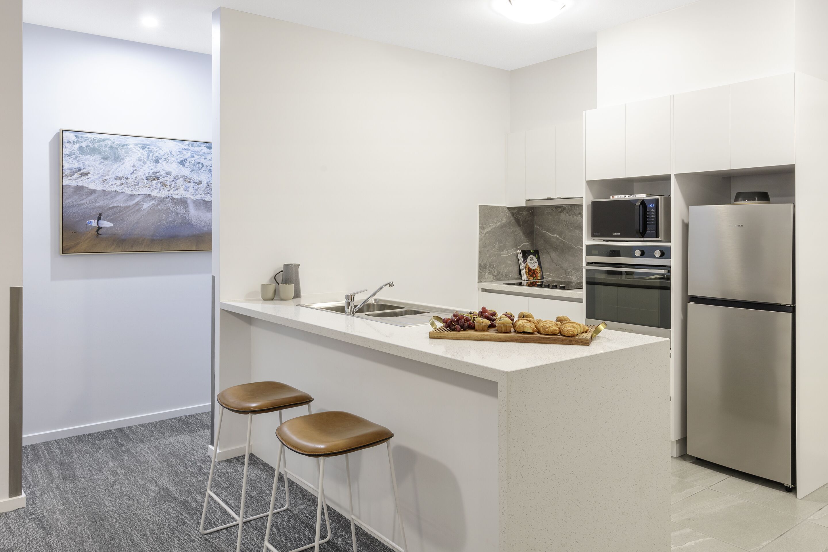 two bedroom executive apartment | private kitchen | fridge, stovetop, electric kettle, toaster