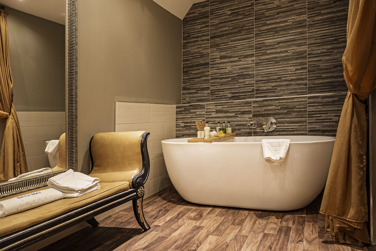 deluxe suite | bathroom | free toiletries, hair dryer, bathrobes, slippers
