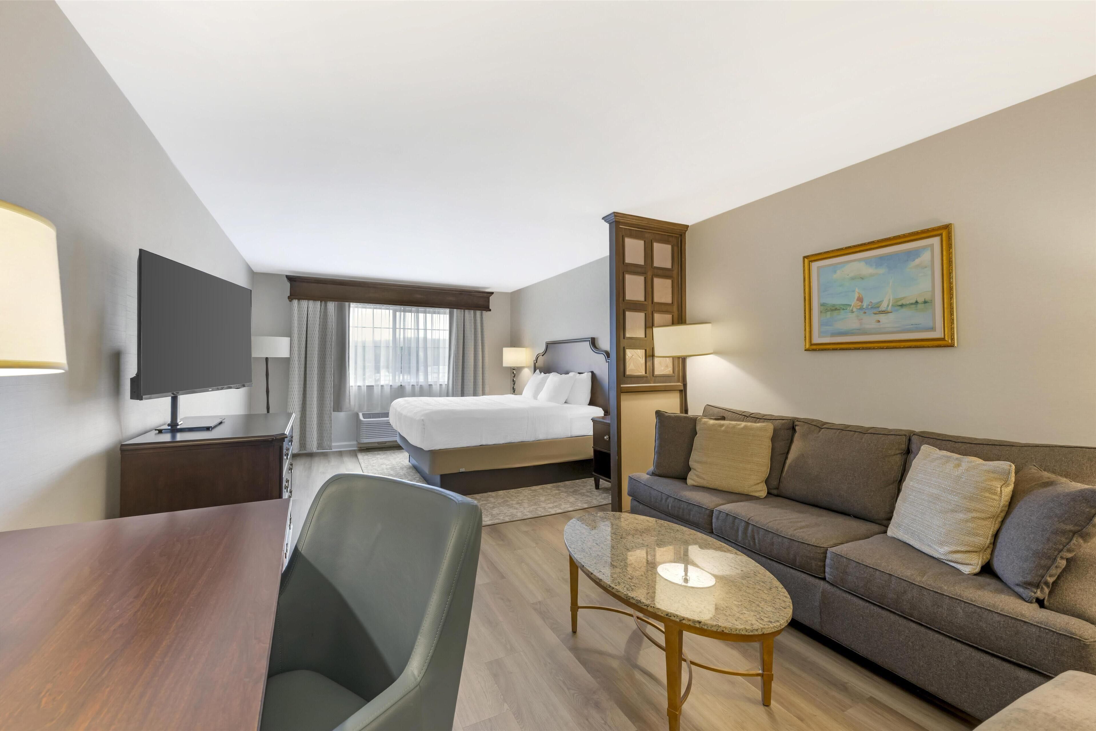 deluxe room, 1 king bed, non smoking, refrigerator & microwave (with sofabed) | premium bedding, in-room safe, laptop workspace, blackout curtains