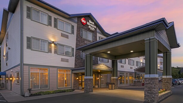 A Best Western Plus hotel with a covered entrance, multiple windows, and a brick facade. - Best Western Plus Vineyard Inn & Suites (Penn Yan)