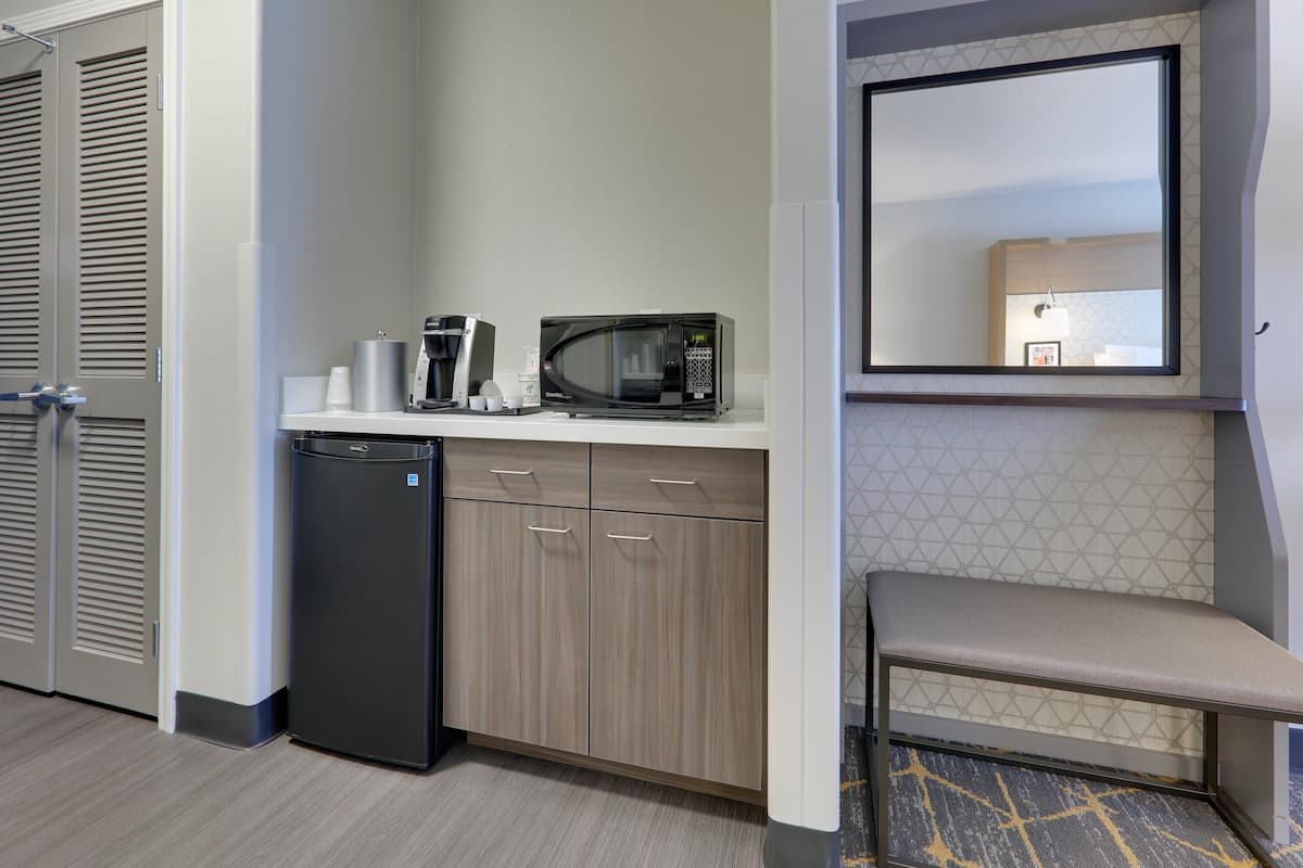 desk, laptop workspace, blackout curtains, iron/ironing board