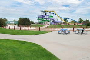 A water park with multiple slides and picnic tables. - Holiday Inn Express Hotel & Suites Bismarck by IHG (Bismarck)