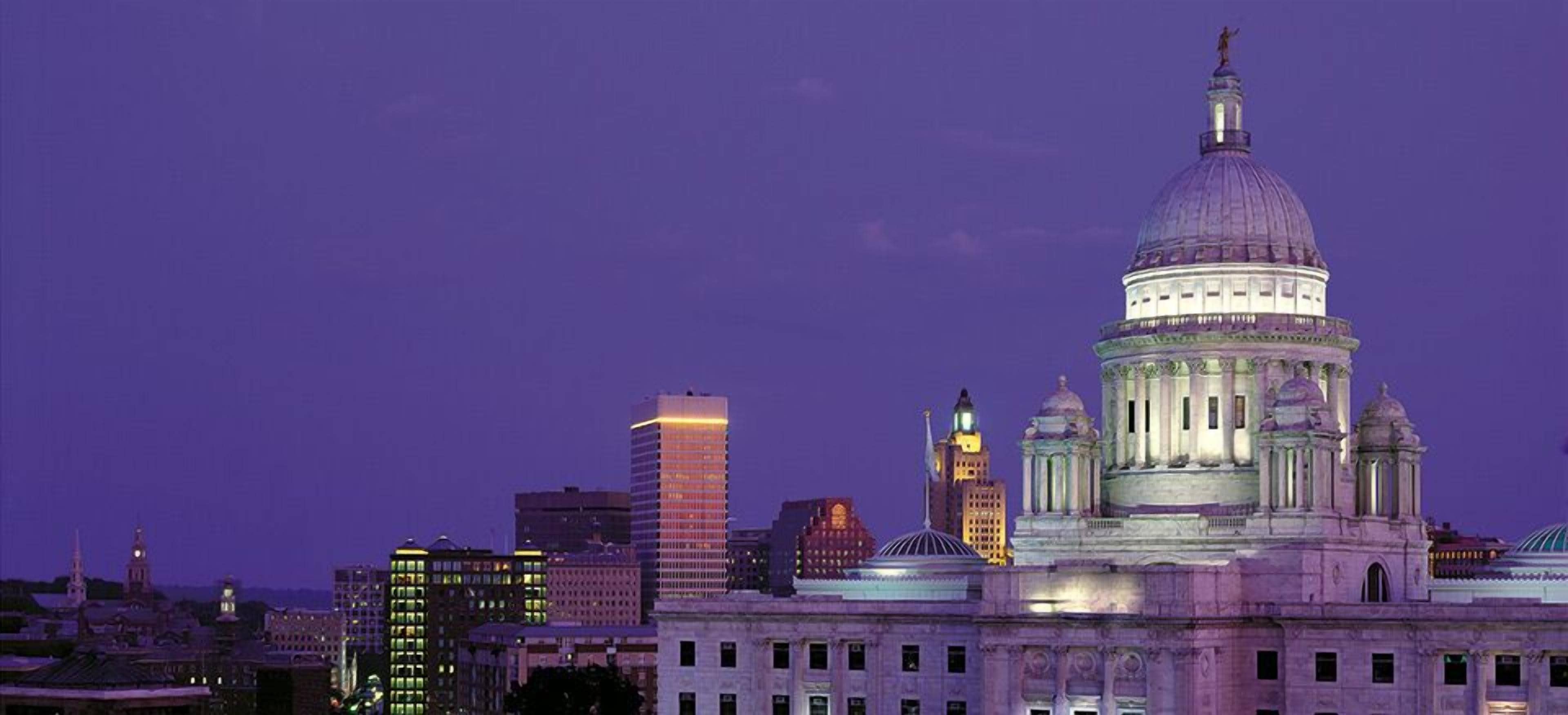 A cityscape with a prominent domed building, likely a government or historical structure, with surrounding modern high-rise buildings.