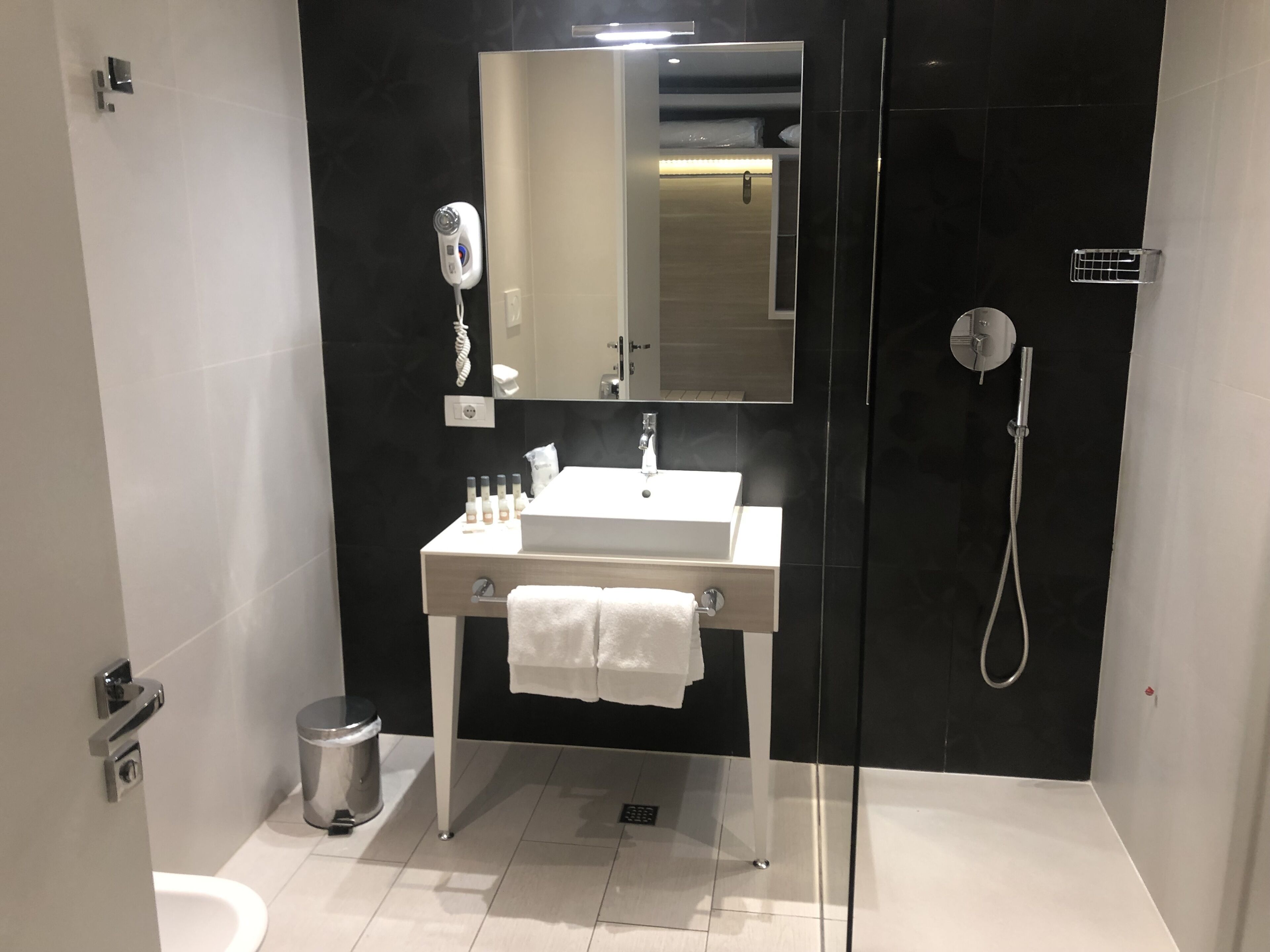 hair dryer, slippers, bidet, towels