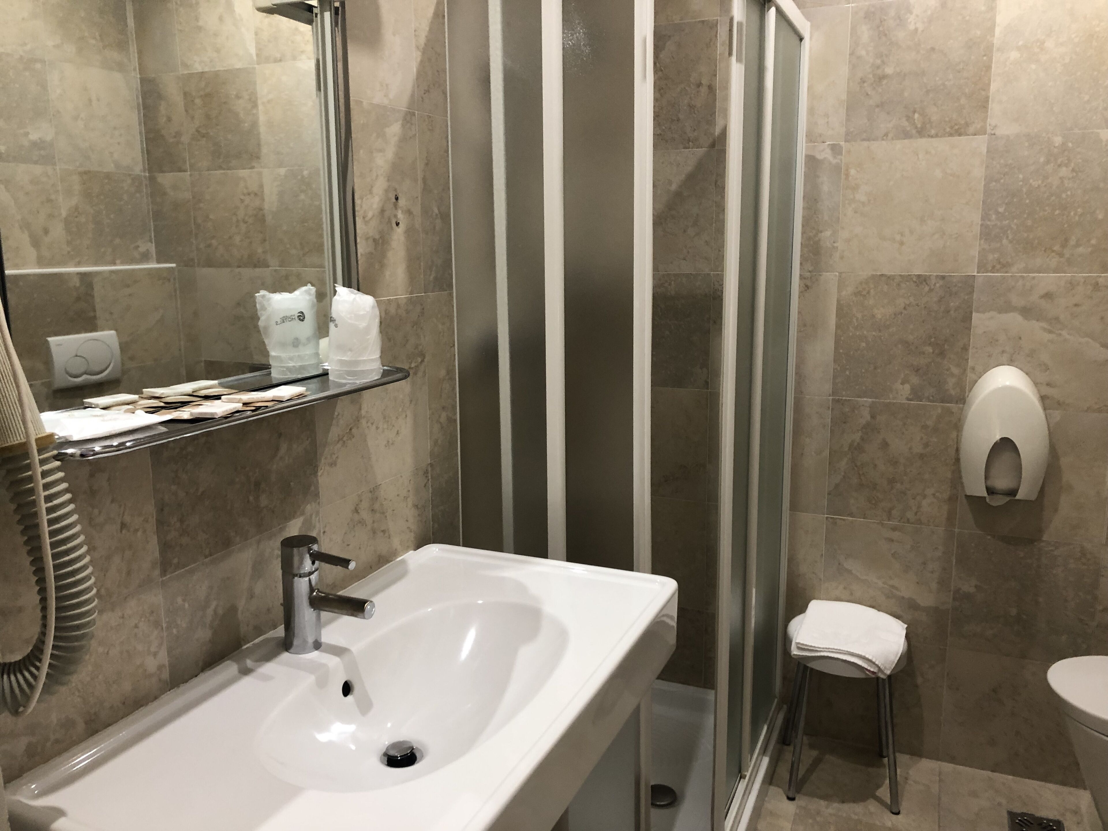 hair dryer, slippers, bidet, towels