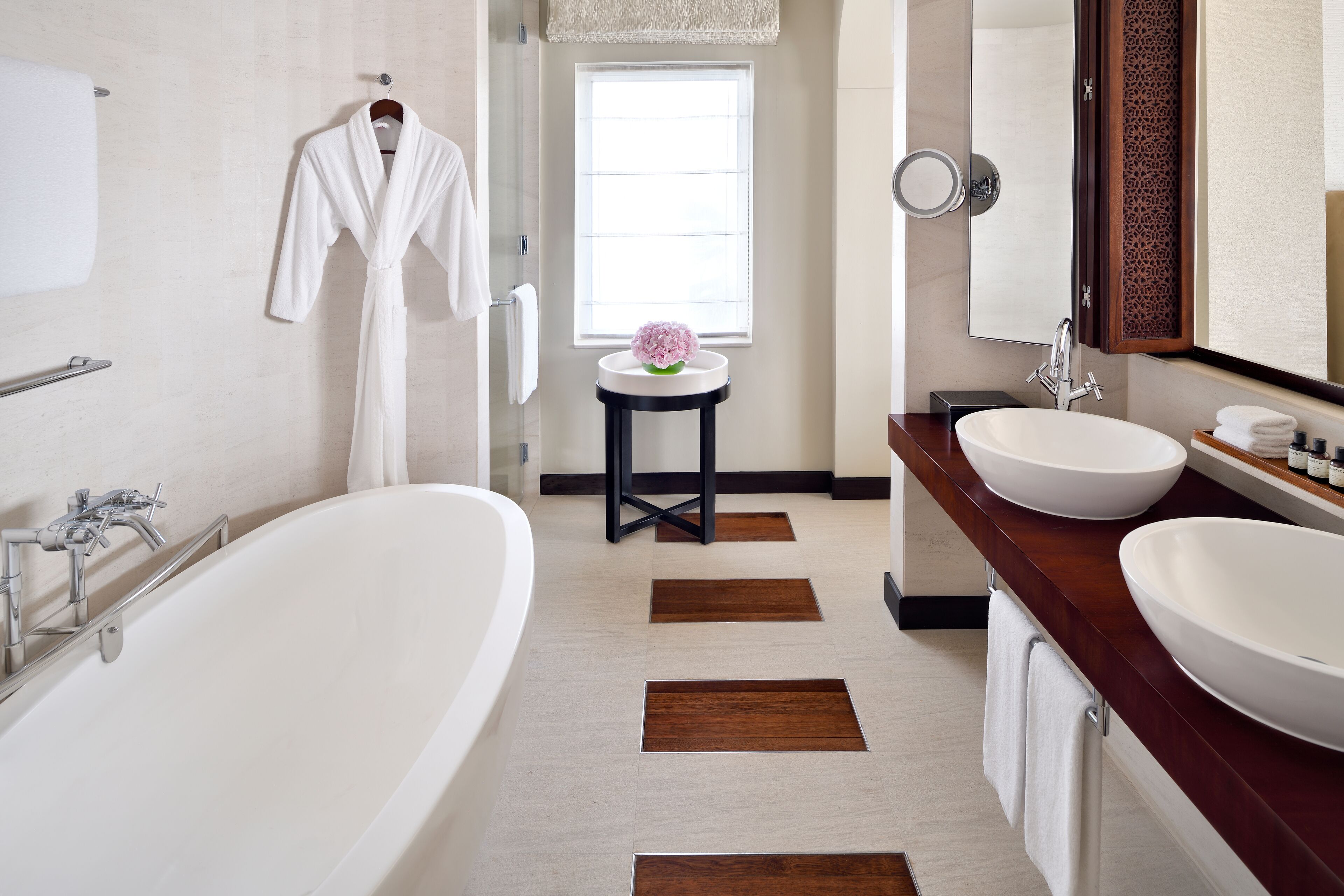 deep-soaking bathtub, designer toiletries, hair dryer, bathrobes