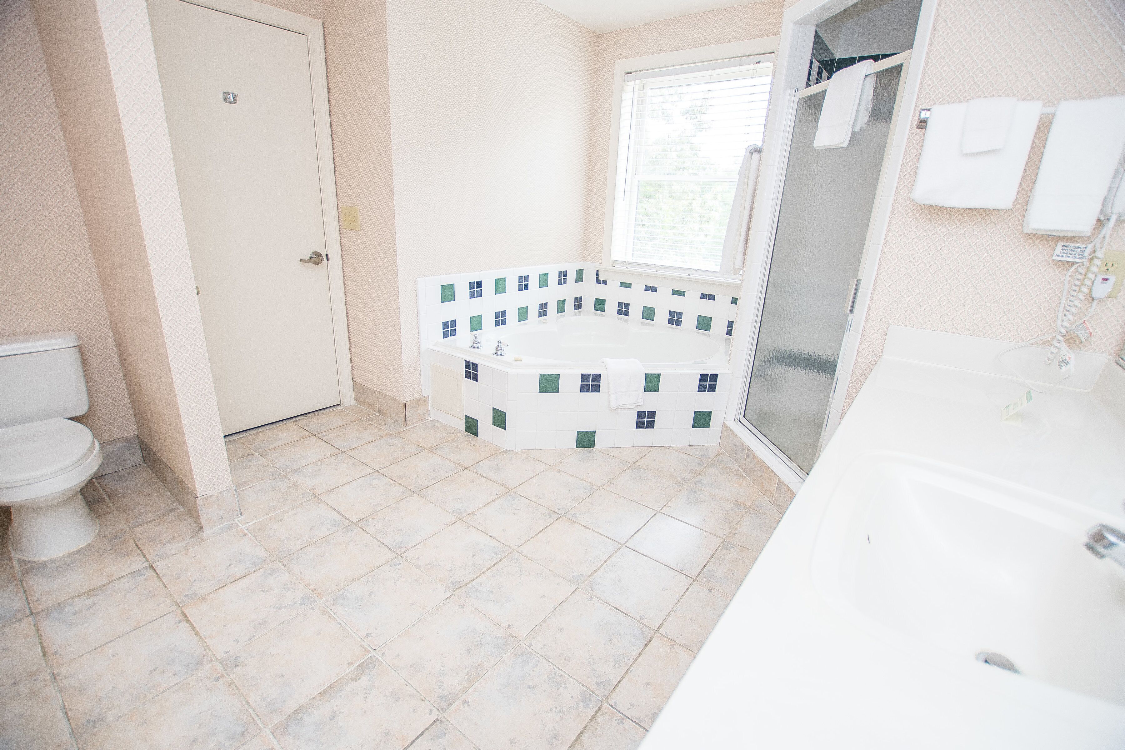 king suite with parlor | bathroom | free toiletries, hair dryer, towels, soap