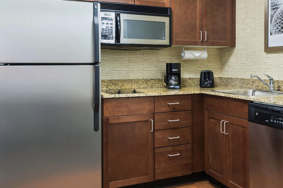 full-sized fridge, microwave, stovetop, dishwasher