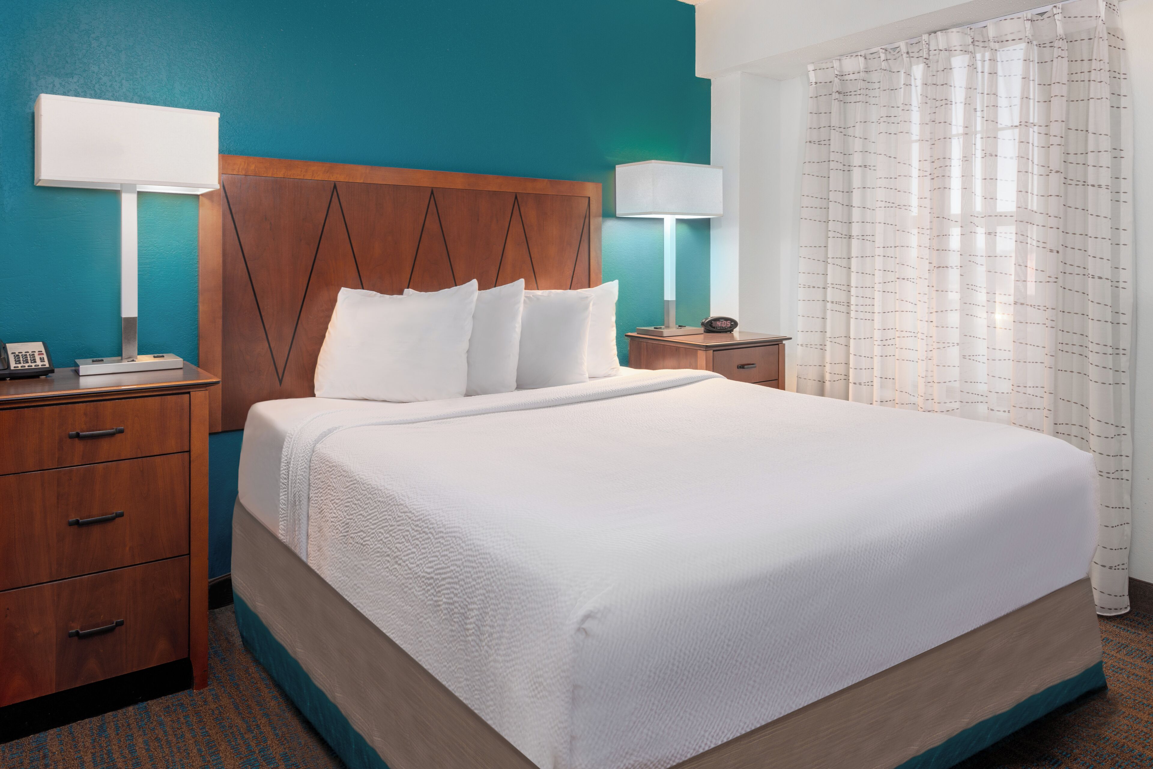 premium bedding, desk, laptop workspace, blackout curtains